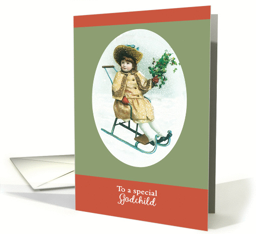 To a special Godchild, Merry Christmas, girl on sleigh, holly card