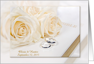 Wedding Rings and Roses on White Bible with Newlywed Names card