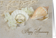 Wedding Anniversary, wedding rings and seashells in beach sand card