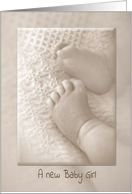 Baby Girl congratulations, newborn feet on soft blanket in sepia tone card