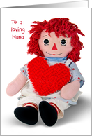 Birthday for Nana old rag doll with red heart isolated on white card