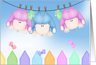birth announcement of triplets hanging on clothesline card