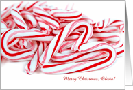 pile of Christmas candy canes with heart and customized name card