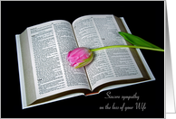 Loss of Wife, pink tulip on open Holy Bible on black card
