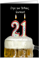 Grandson’s 21st birthday candles in mug of beer on black card