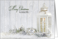 Wife’s Christmas, white lantern with holiday ornaments and pine cones card