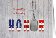 Son on Veterans Day military dog tags with flag font on wood card