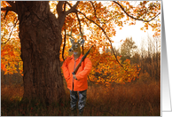 Deer dressed as a hunter with rifle in autumn woods card