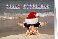 tropical starfish on beach with Christmas Santa hat card