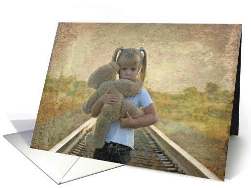 sad little girl with teddy bear on railroad tracks for Friendship card