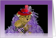 Birthday teddy bear wearing a red hat and purple boa card