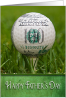 Father’s Day, golf ball on tee in grass with money logo card