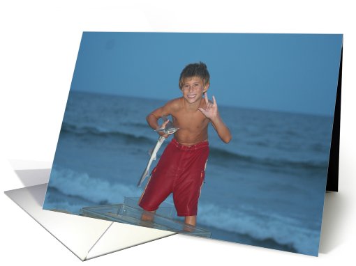 Sign Language at the beach, boy with fish card (616094)