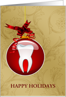 Hanging Red Ornament with Tooth Inside on Gold Back Happy Holidays card