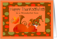 Thanksgiving to Son, Boy hiding behind pumpkin wearing a big hat card