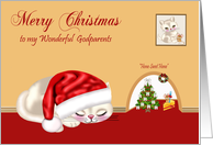 Christmas to Godparents, cat wearing Santa hat sleeping by mouse hole card