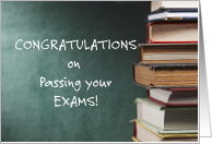 Congratulations, on passing your exams.pile of books.blank card, blackboard. card