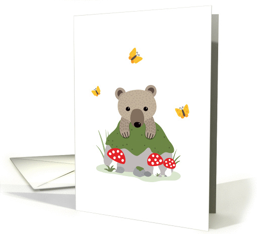 Bear cub and butterflies behind mossy forest rock card (1452220)