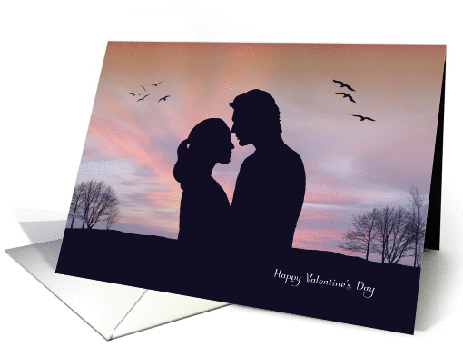 Loving Couple Stand Close in Front of Sunset for Valentines Day card