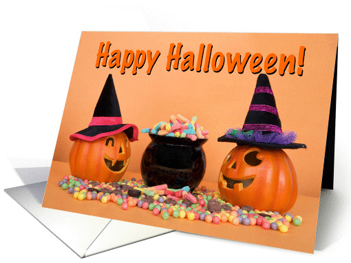Pumpkin witches with cauldron of candy wishing Happy Halloween card
