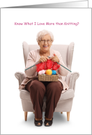Humorous senior citizen woman smiling and knitting card