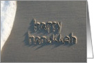 happy hanukkah, written in sand card