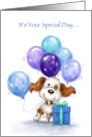 Cute dog with balloons and present to cerebrate birthday. card