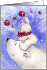 Polar cub climbing on head of his mother to catch red Christmas bauble card