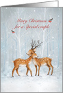 Dear couple cuddling in snowy wood,Merry Christmas for a couple card