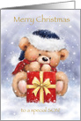 Merry Christmas for a special son,cute bear with scarf behind present. card