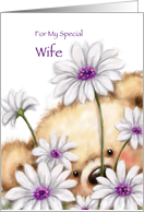 Cute furry bear holding beautiful flowers for wife’s birthday. card