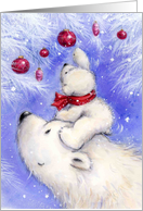 Polar cub climbing on head of his mother to catch red Christmas bauble card