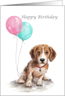 Puppy sitting with pink & blue green balloons for Happy Birthday card