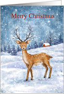 Dear standing in snowy forrest with tree and house, Merry Christmas card