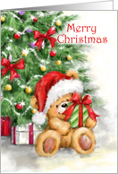 Merry Christmas Bear Holding Present in front of Christmas Tree card