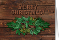 Merry Christmas! Rustic Wood with Pine Branches and Holly Leaves Swag card