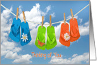 Thinking of You, colorful flip-flops on a clothesline with daisies card