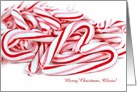 pile of Christmas candy canes with heart and customized name card