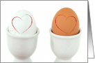 Anniversary red hearts on hard boiled eggs in white cups card