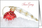 Season’s Greetings-red Christmas ornament in snow with elegant ribbon card