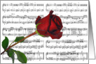 Wedding anniversary red rose on sheet music background card