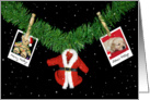 Christmas-holiday photos hanging on garland with old clothespins card