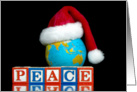 Christmas-Peace wood blocks and Santa hat on world globe card