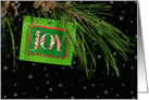 Christmas tag with joy text on pine bough with snowflakes card