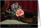 Anniversary-rose on a violin with old sheet music card