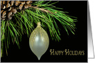 Christmas gold fancy ornament hanging from pine bough card