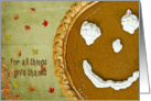 Thanksgiving pumpkin pie with autumn leaves card