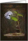 Sympathy purple hydrangea in vintage bottle with old frame card