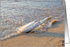 Happy Birthday message in a bottle on a beach card