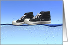 pair of black sneakers walking on water card